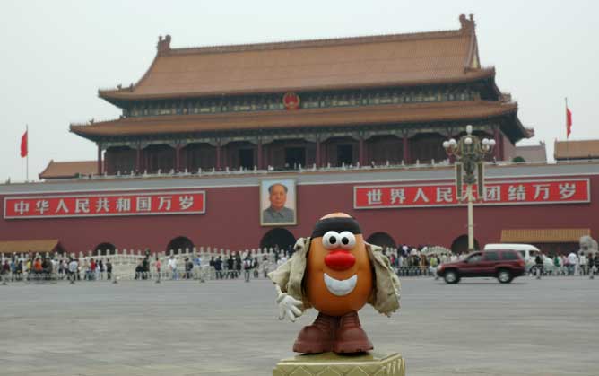 The enormous portrait of Mao Zedong guards watches over the entrance to the Forbidden City