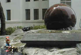 Spud and Doreen take advantage of the Strait's Trading Company's spinning ball fountain to go for a skinny dip