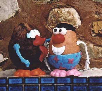 Mandy proceeds to clean Spud's ear canal with her tongue