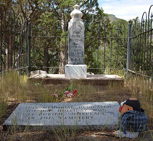 Spud reads the ambiguous location marker for Doc Holliday