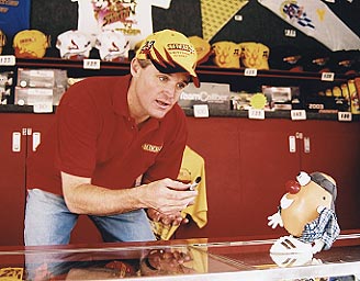 NASCAR driver Kenny Wallace tries to suck up to Spud for his autograph