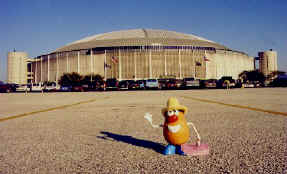 Monster trucks await inside the giant Houston Astrodome